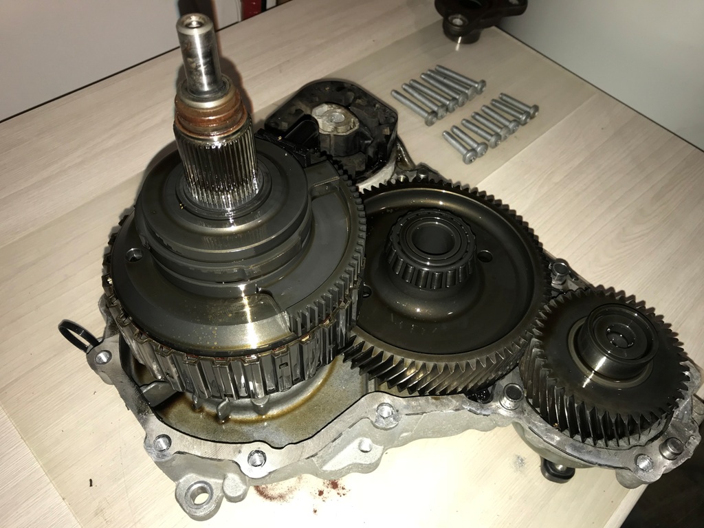 Transfer case stripped for inspection showing internal gears and clutch pack